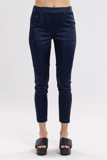 The Satin Section Pant is your go-to slightly more dressy NES essential, offering effortless style and unmatched comfort. With fabulous spliced detailing, this pant combines a sleek flat front with an elasticated back for the perfect fit. Side pockets provide practicality, while the 7/8 length and satin finish add an elevated touch to your look. Whether you're dressing up for a night out, office wear, or a special occasion, these versatile pants can easily be styled for any event. Elegant, stylish, and desi
