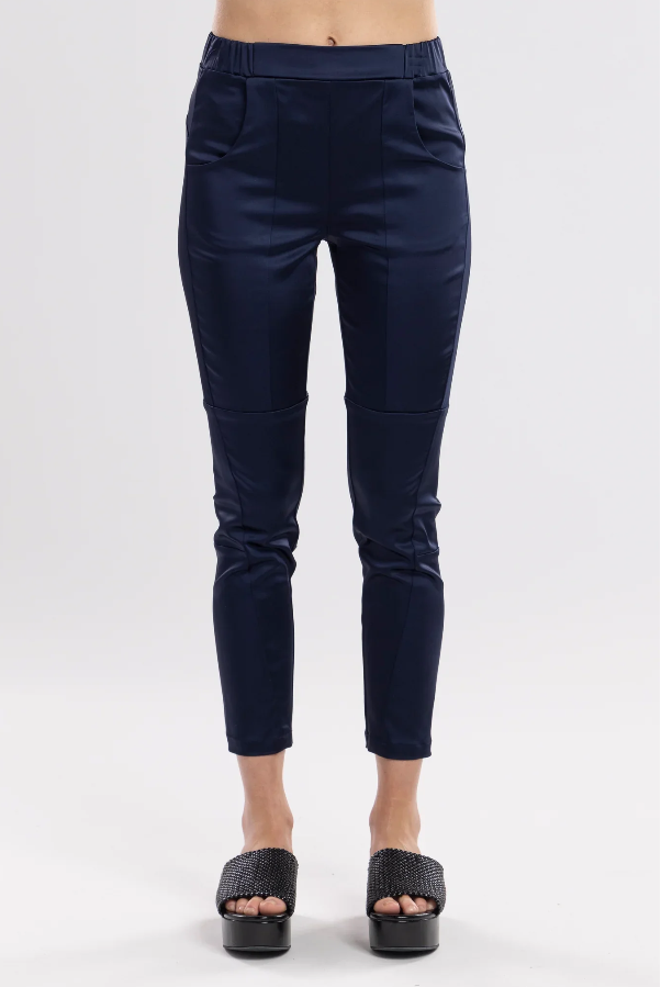 The Satin Section Pant is your go-to slightly more dressy NES essential, offering effortless style and unmatched comfort. With fabulous spliced detailing, this pant combines a sleek flat front with an elasticated back for the perfect fit. Side pockets provide practicality, while the 7/8 length and satin finish add an elevated touch to your look. Whether you're dressing up for a night out, office wear, or a special occasion, these versatile pants can easily be styled for any event. Elegant, stylish, and desi