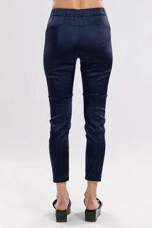 The Satin Section Pant is your go-to slightly more dressy NES essential, offering effortless style and unmatched comfort. With fabulous spliced detailing, this pant combines a sleek flat front with an elasticated back for the perfect fit. Side pockets provide practicality, while the 7/8 length and satin finish add an elevated touch to your look. Whether you're dressing up for a night out, office wear, or a special occasion, these versatile pants can easily be styled for any event. Elegant, stylish, and desi