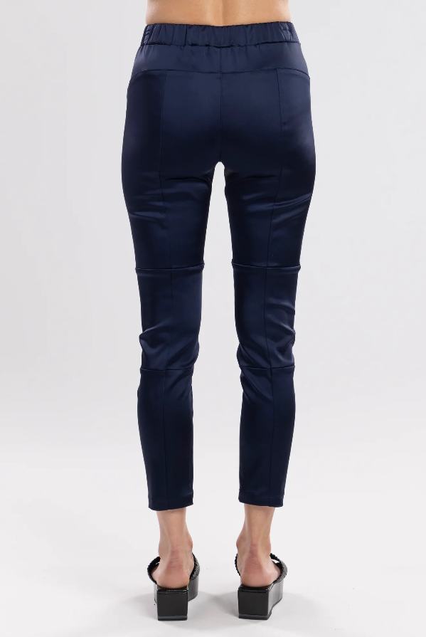 The Satin Section Pant is your go-to slightly more dressy NES essential, offering effortless style and unmatched comfort. With fabulous spliced detailing, this pant combines a sleek flat front with an elasticated back for the perfect fit. Side pockets provide practicality, while the 7/8 length and satin finish add an elevated touch to your look. Whether you're dressing up for a night out, office wear, or a special occasion, these versatile pants can easily be styled for any event. Elegant, stylish, and desi