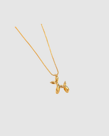 Balloon Dog Necklace by Castel & Co in radiant gold plating, featuring a playful sculptural pendant inspired by a balloon dog design. Suspended on a fine chain for a modern, whimsical statement that can be worn solo or layered. Lobster claw closure with a 40 + 5 cm adjustable length. Crafted from stainless steel, waterproof, hypoallergenic, and weighing 12g.