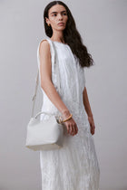 Alēo Bonbon Tote handbag&nbsp;

features:

tote shaped top handle bag | detachable tonal crossbody strap with magnetic closure | featuring a foil embossed signature on front