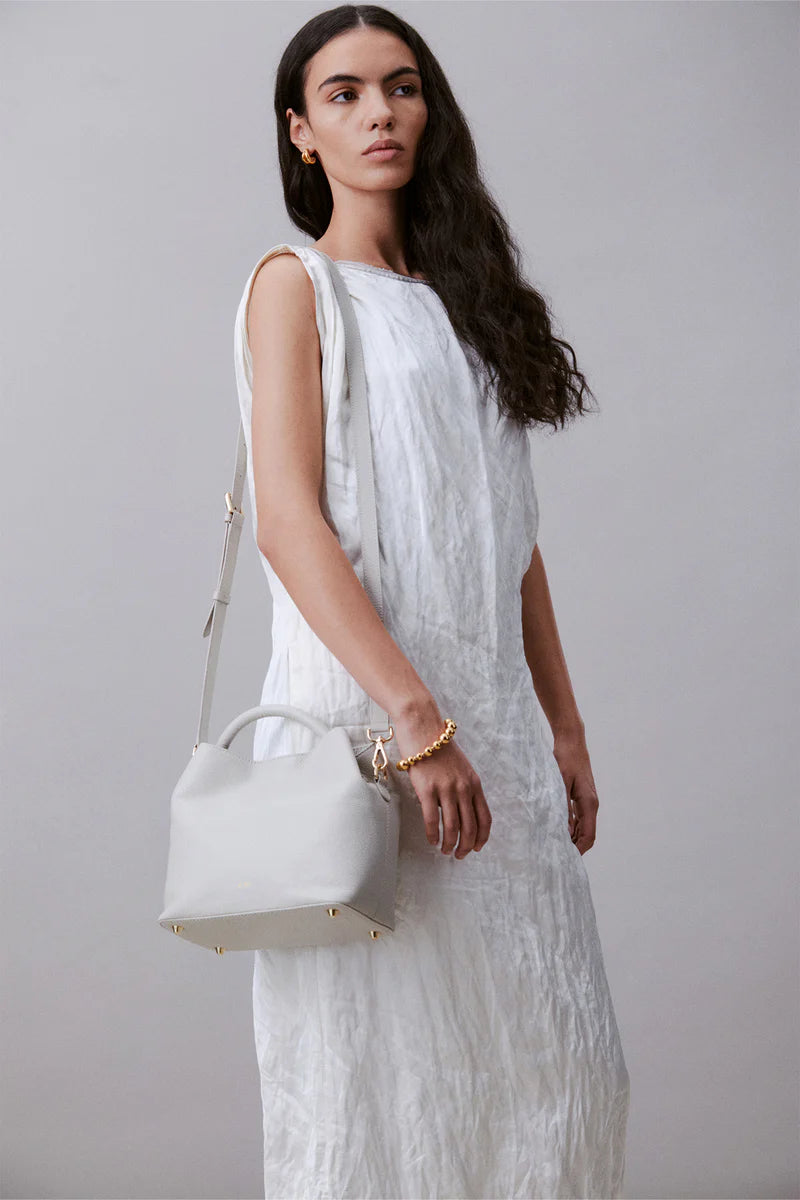 Alēo Bonbon Tote handbag&nbsp;

features:

tote shaped top handle bag | detachable tonal crossbody strap with magnetic closure | featuring a foil embossed signature on front