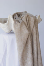 Meet the layer you’ll reach for repeatedly. Worn as a shawl, wrap or scarf, this timeless piece moves effortlessly from slow mornings to cool evenings. Cosy yet refined, it’s made for early yoga flows, windswept beach sunsets, and everything in between.

Lightweight but warming, it’s the ultimate travel companion - wrapping you in comfort and that familiar, at-home feeling wherever you land.

Available in: Mulberry &amp; Hazelnut.

Details
• Approx. 76cm x 188cm
• Cool hand-wash, dry with care
• Handwoven i