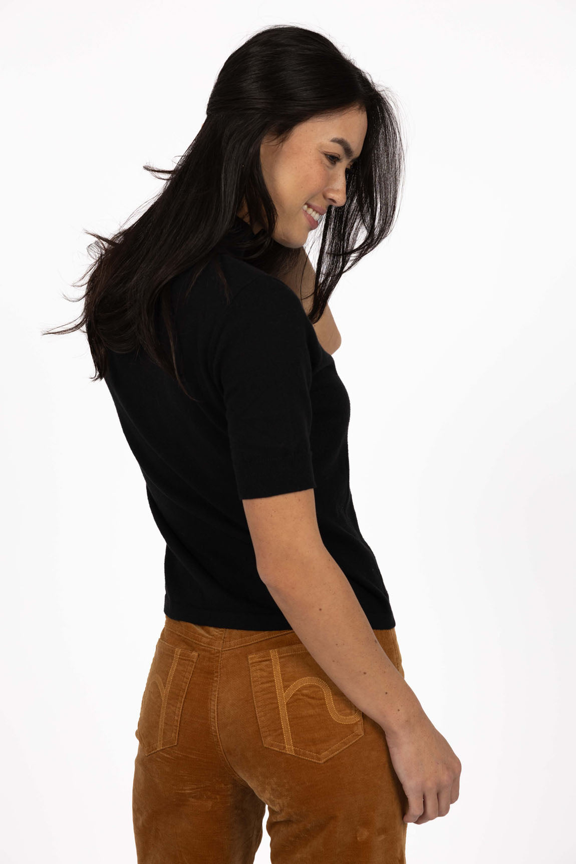 Vera knit top available in black, claret, and hazelnut, crafted from a soft, lightweight cotton/cashmere blend. Designed with a high neckline, sleeves finishing just above the elbow, and ribbed detailing on the neck, cuffs, and hem. The length sits just below the hips, making it ideal for easy tucking and layering. A cosy, non-itch knit perfect for cooler weather, offering a comfortable, true-to-size fit for both work and weekend wear.