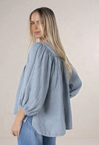 HUMIDITY LIFESTYLE - BAROQUE BLOUSE
A timeless piece with a touch of artisanal charm. This beautifully oversized blouse is crafted from 100% linen- breathable and natural. Designed with softly billowing sleeves and handcrafted bead detailing, it’s all about effortless elegance. This piece pairs just as beautifully with tailored pants as it does with your favourite denims.