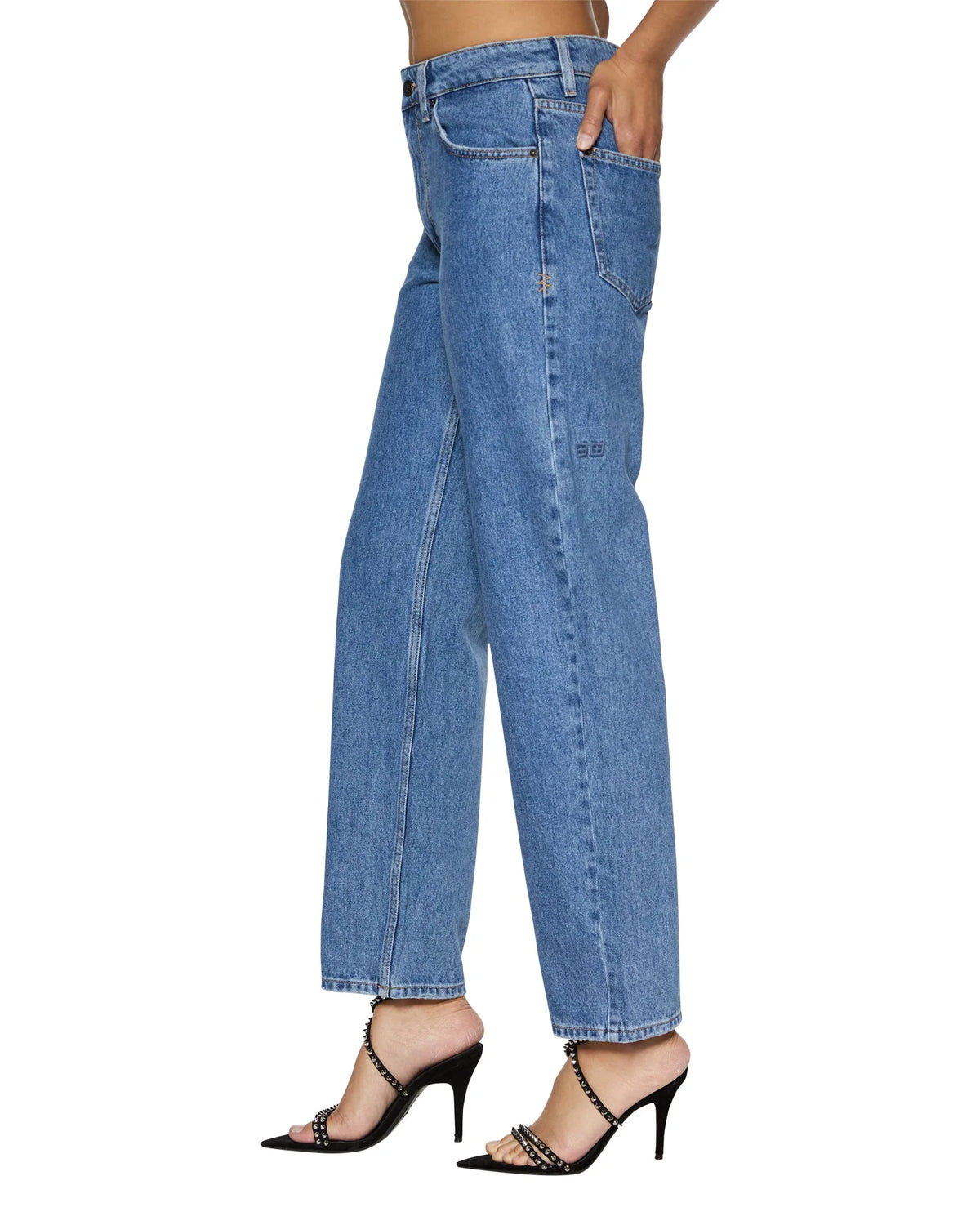 A mid-rise, relaxed straight-leg jean designed to sit below the waist with a more relaxed fit at the thigh and crotch to prevent gaping.&nbsp;It is made from premium European rigid denim in heritage stone-washed blue and features branded anti-silver hardware, T-box print, and back cross embroidery.