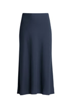 A best-selling staple, reimagined in a breathable linen blend. The N-E-S Linen Muse Skirt is designed to flatter through movement and cut, offering an easy yet elevated piece that works across seasons and occasions.

Cut on the bias, the Muse Skirt skims the body with a soft, fluid drape that enhances its natural shape without clinging. The signature concave front and subtly dropped back hem create a modern, directional silhouette, while the raw hemline adds an understated edge.