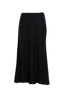 A best-selling staple, reimagined in a breathable linen blend. The N-E-S Linen Muse Skirt is designed to flatter through movement and cut, offering an easy yet elevated piece that works across seasons and occasions.

Cut on the bias, the Muse Skirt skims the body with a soft, fluid drape that enhances its natural shape without clinging. The signature concave front and subtly dropped back hem create a modern, directional silhouette, while the raw hemline adds an understated edge.