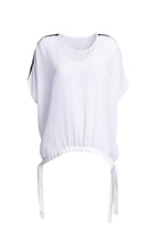 A true N-E-S icon, the Vanotti Tape Top is the piece customers return for season after season. Light, relaxed and beautifully easy to wear, it’s designed to be your effortless throw-on style for days when comfort and simplicity matter most.