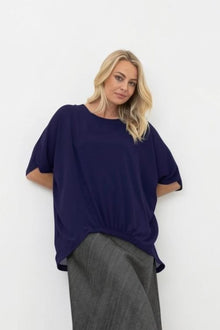 N-E-S Repeat Top - A Favourite, Repeated

Back for summer by popular demand. The N-E-S Repeat Top is a top-selling silhouette loved for its effortless drape, relaxed shape and clever detailing that does the styling for you.

Designed and made responsibly in New Zealand