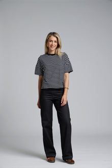 NES DollyB Denim Pants by N-E-S – a wide-leg stretch denim pant with fold-down rib waistband and contrast stitching. Available in blue or black denim. NZ made.