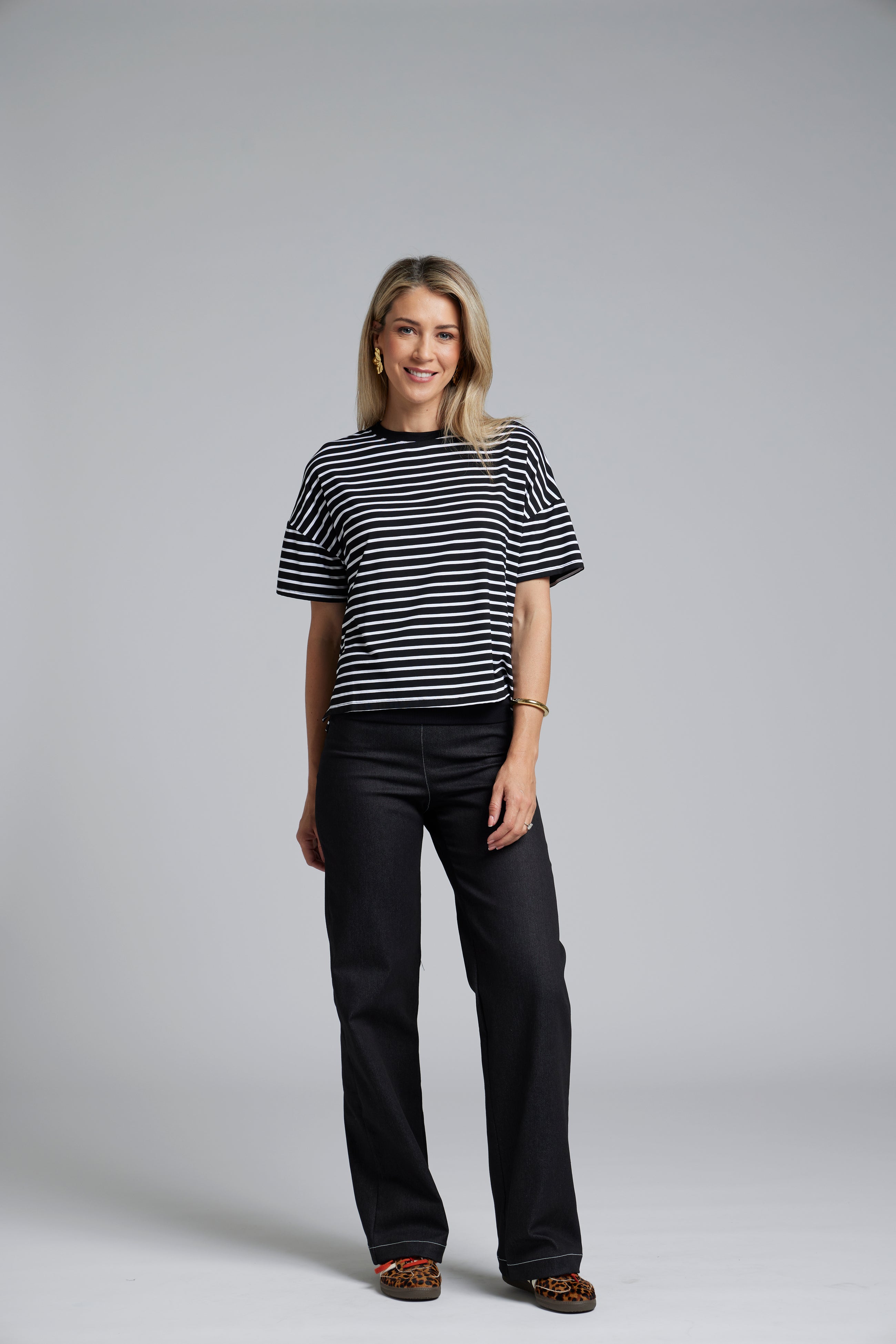 NES DollyB Denim Pants by N-E-S – a wide-leg stretch denim pant with fold-down rib waistband and contrast stitching. Available in blue or black denim. NZ made.