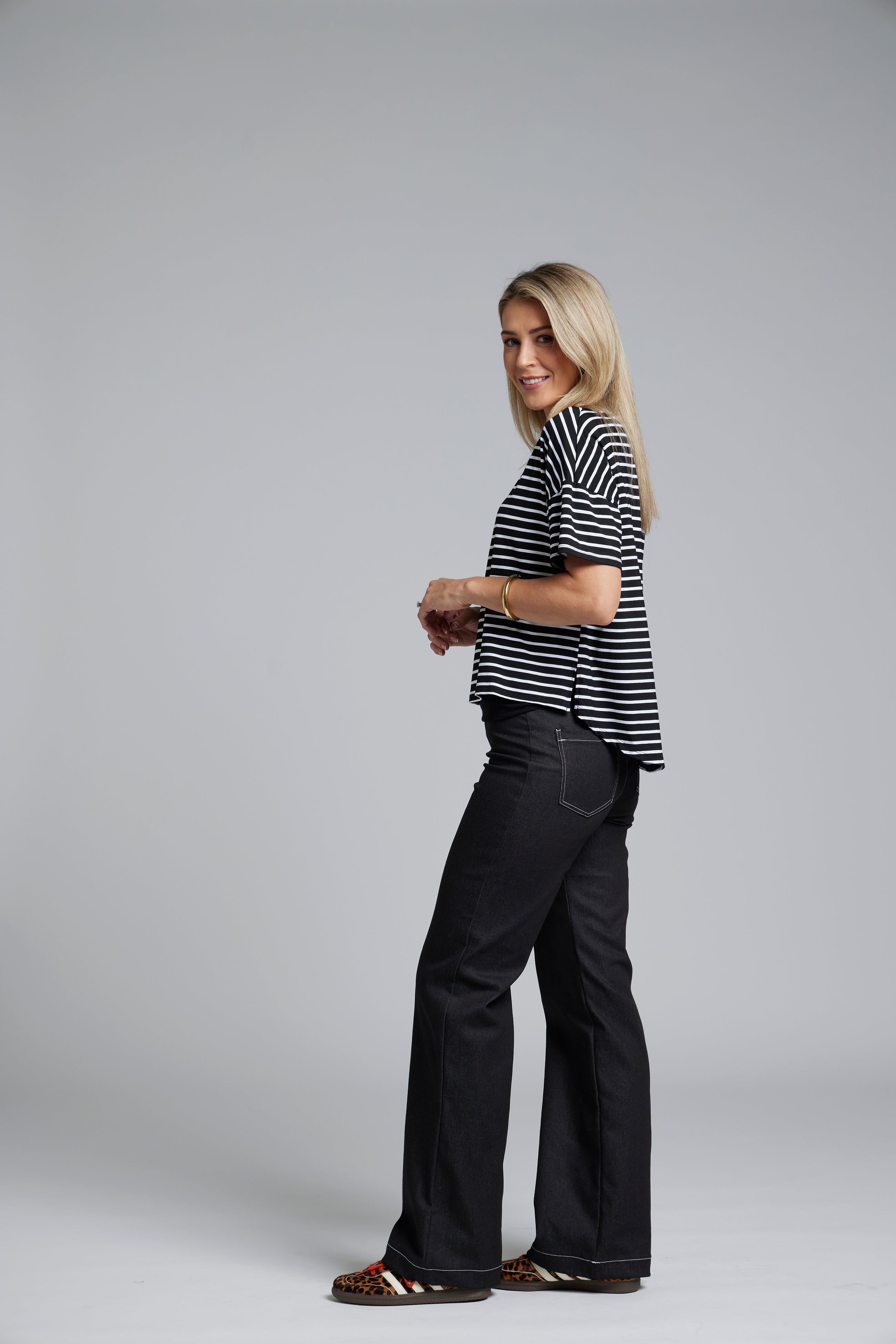 NES DollyB Denim Pants by N-E-S – a wide-leg stretch denim pant with fold-down rib waistband and contrast stitching. Available in blue or black denim. NZ made.