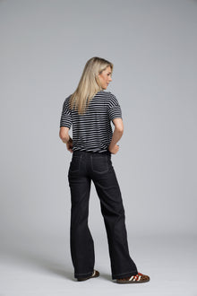 NES DollyB Denim Pants by N-E-S – a wide-leg stretch denim pant with fold-down rib waistband and contrast stitching. Available in blue or black denim. NZ made.