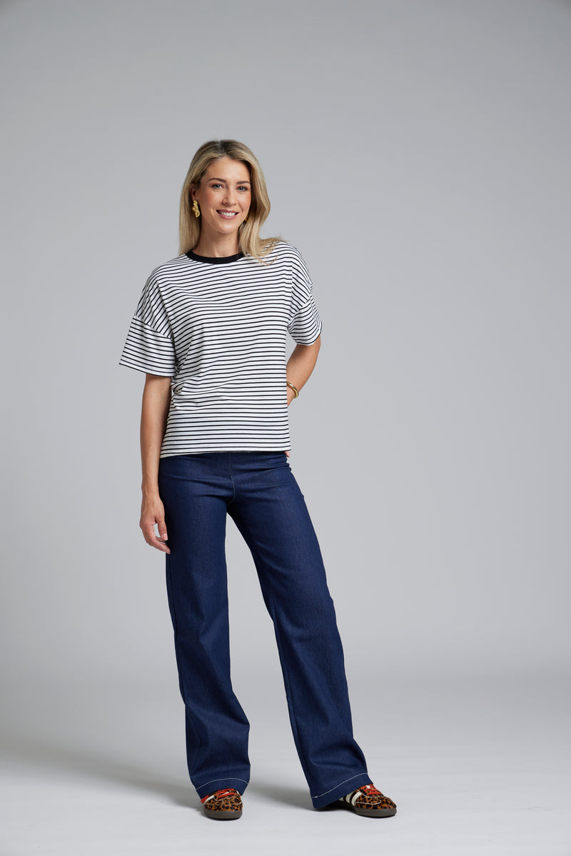 NES DollyB Denim Pants by N-E-S – a wide-leg stretch denim pant with fold-down rib waistband and contrast stitching. Available in blue or black denim. NZ made.