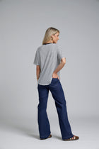 NES DollyB Denim Pants by N-E-S – a wide-leg stretch denim pant with fold-down rib waistband and contrast stitching. Available in blue or black denim. NZ made.