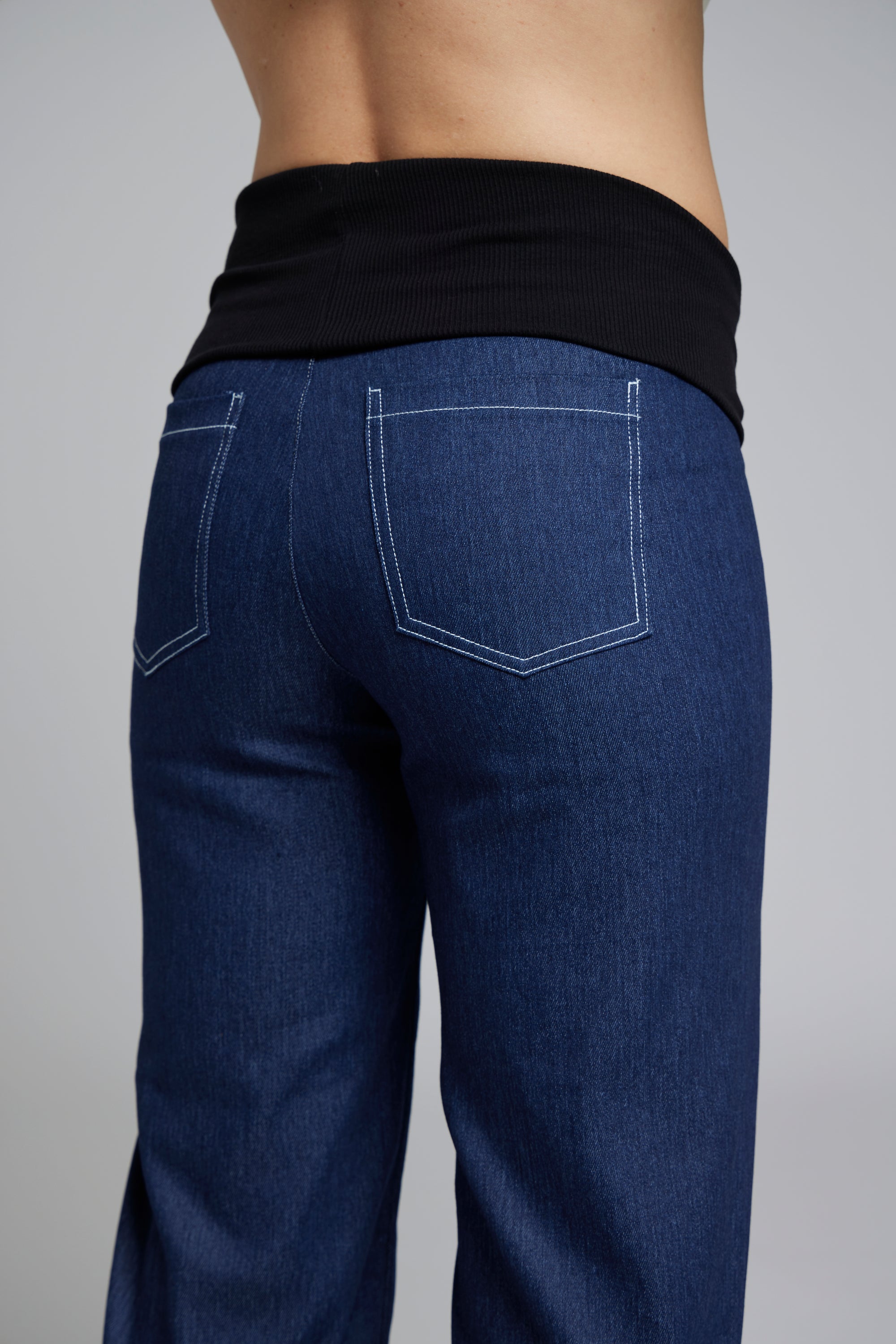 NES DollyB Denim Pants by N-E-S – a wide-leg stretch denim pant with fold-down rib waistband and contrast stitching. Available in blue or black denim. NZ made.