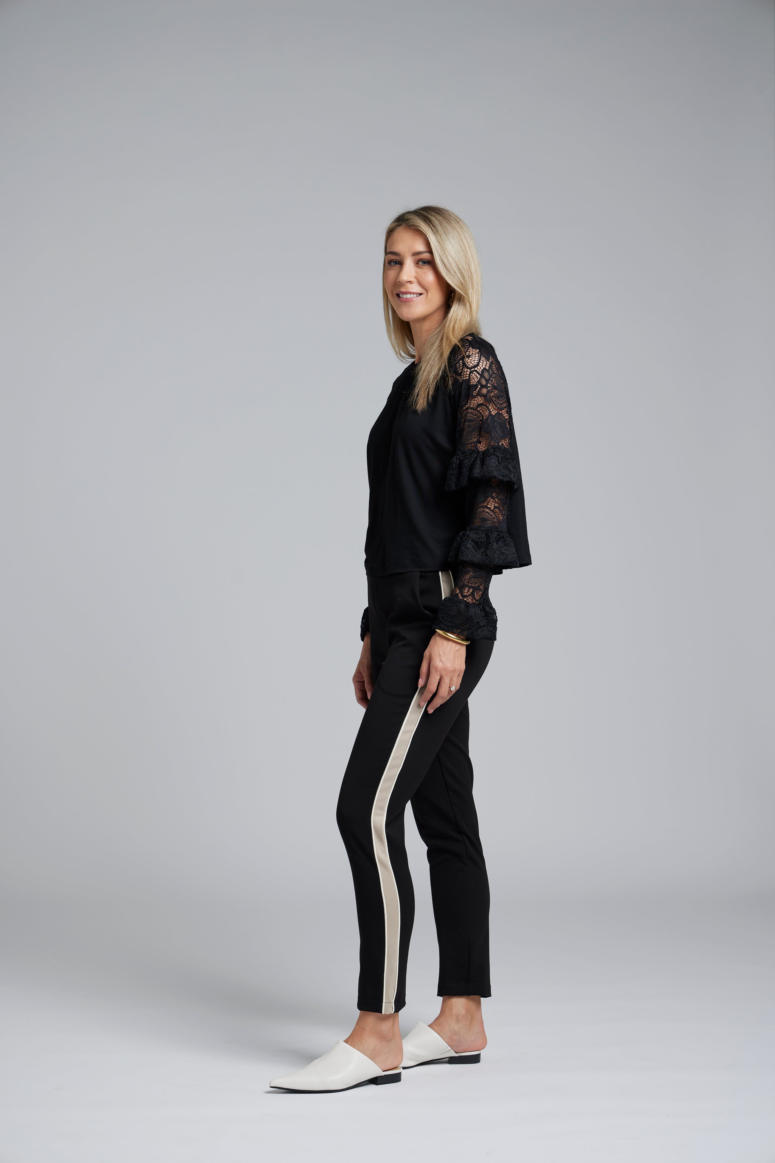 NES Luxa Top by N-E-S – a black merino long sleeve with ruffled lace dolman sleeves, subtle gathers and keyhole back. Sculptural, modern and NZ made.