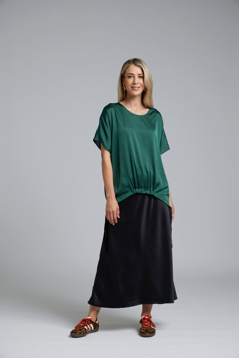 The NES Muse Satin Skirt – a full-length hammered satin skirt with bias cut, elasticated waist and soft high-low hem. Elegant and easy. NZ made.
