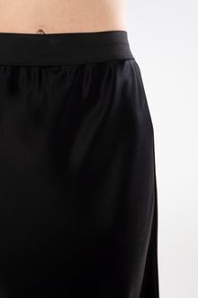 The NES Muse Satin Skirt – a full-length hammered satin skirt with bias cut, elasticated waist and soft high-low hem. Elegant and easy. NZ made.