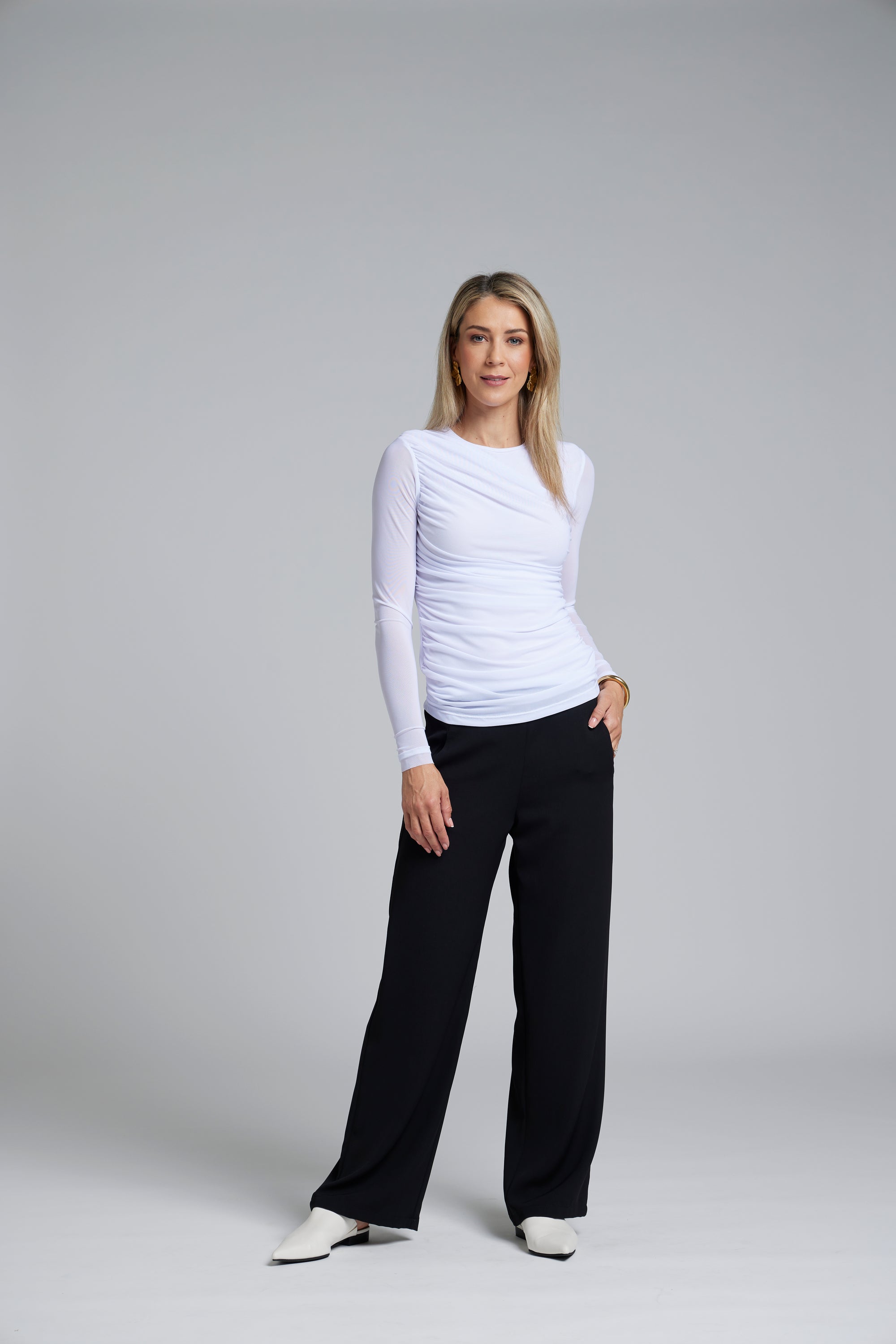 The NES Rumour Top by N-E-S – a sheer long-sleeve mesh top with front rouching and double-layered front. Sculpted, modern and NZ made.