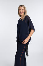 The NES Vanotti Tunic by N-E-S’ best-selling throw-on top with a scoop neckline and adjustable feature hem. Perfect over a Lattice Singlet. NZ made.