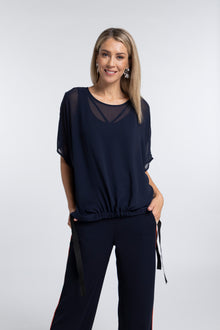 The NES Vanotti Tunic by N-E-S’ best-selling throw-on top with a scoop neckline and adjustable feature hem. Perfect over a Lattice Singlet. NZ made.