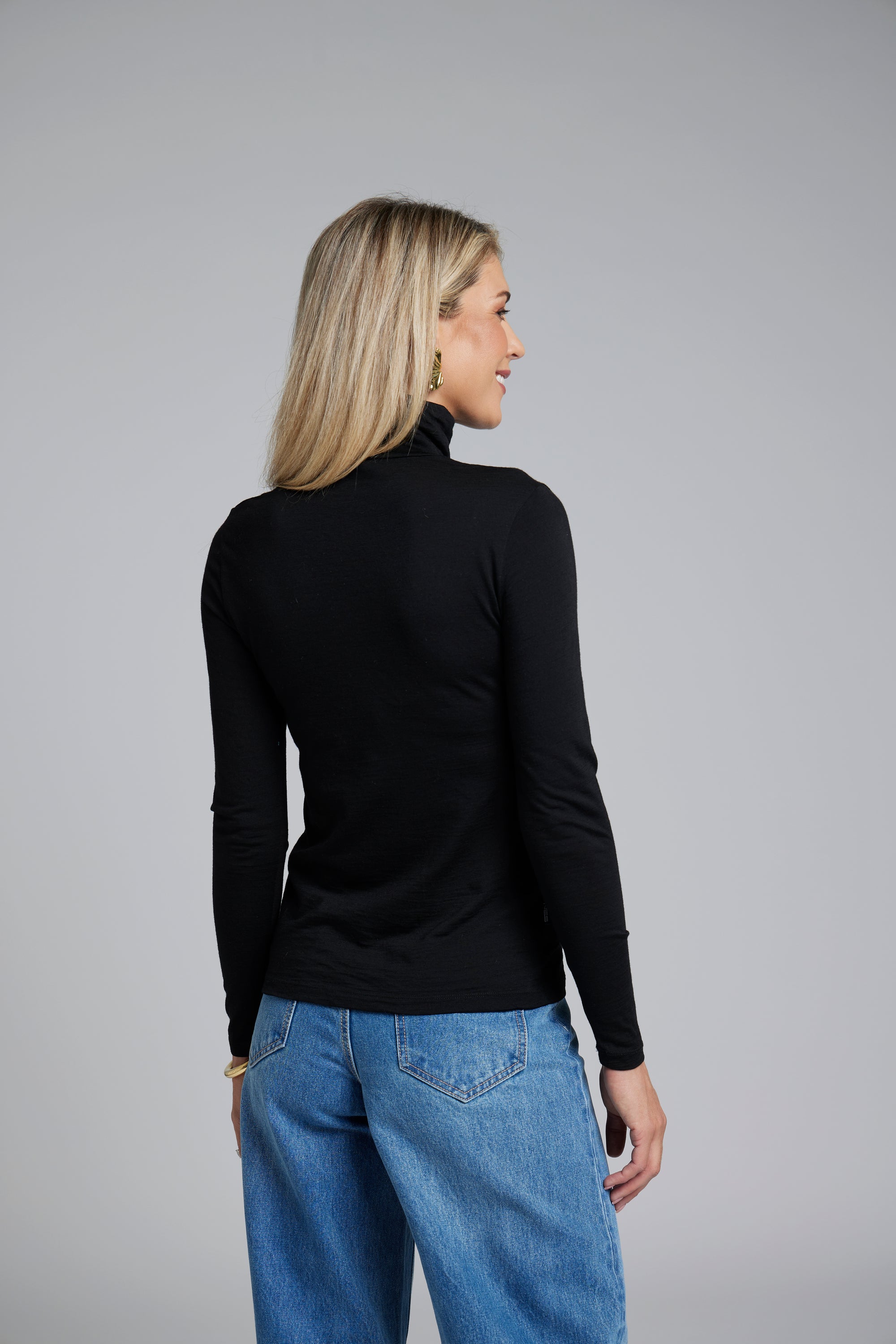 The NES Merino Funnel Neck Top by N-E-S. A warm, soft 100% merino layer with funnel neckline and long sleeves. Wear alone or layered. Winter essential. NZ made.