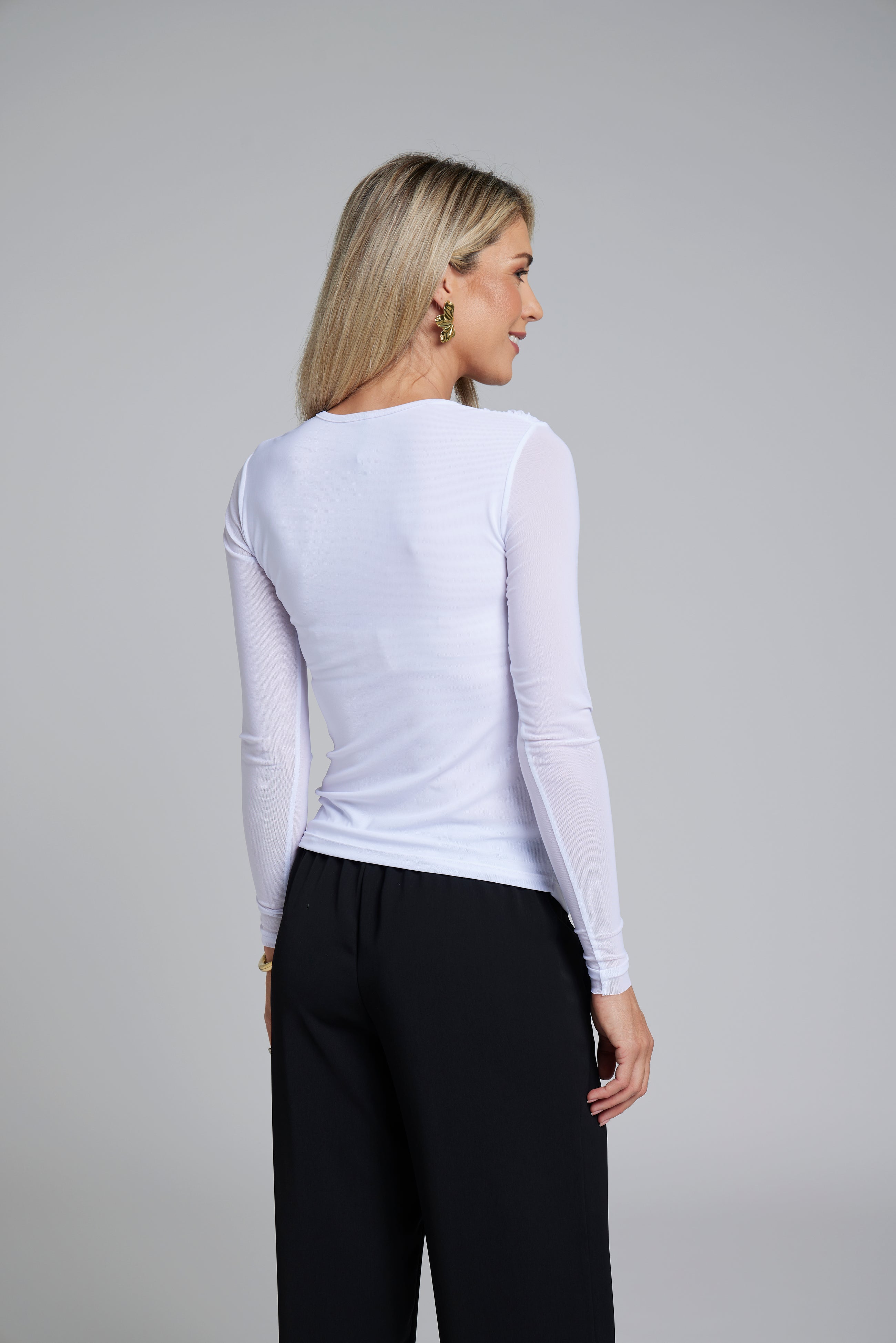 The NES Rumour Top by N-E-S – a sheer long-sleeve mesh top with front rouching and double-layered front. Sculpted, modern and NZ made.