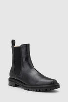Chaos & Harmony OLLIE Boot, a blend of sustainable fashion and distinctive design. Crafted from black recycled leather, these boots are a testament to both style and environmental consciousness. The square toe shape sets a contemporary tone, offering a unique silhouette that stands out. Black recycled leather chelsea boot, Soft leather lined
