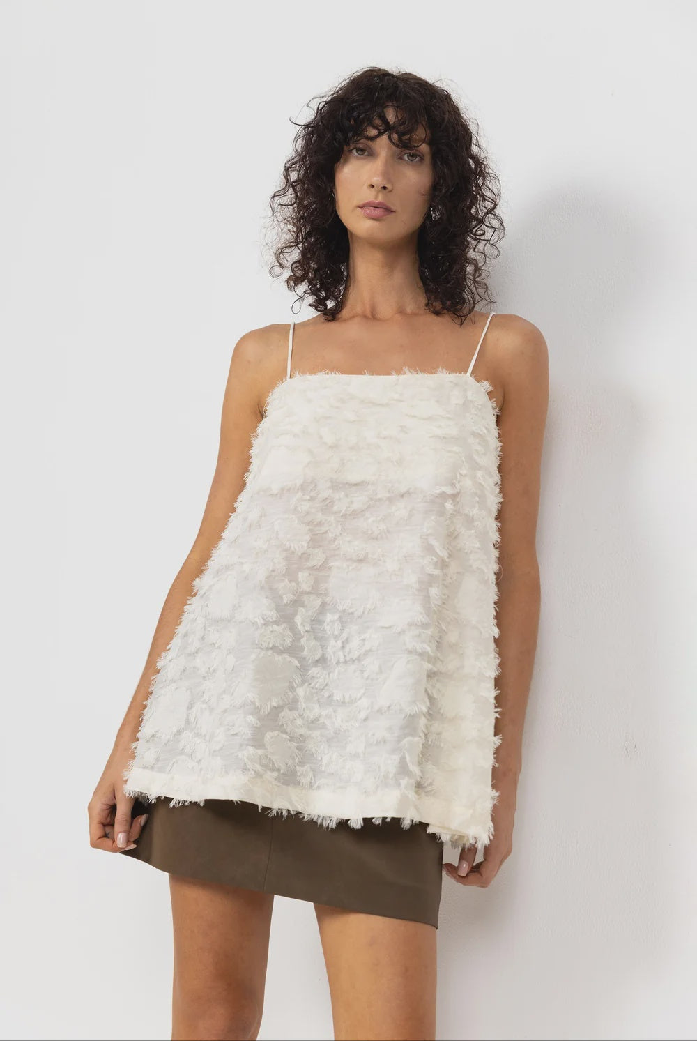 BLAK : The Stay Close Textured Cami is an ivory cami top designed with delicate straps, a sheer textured finish and adjustable tie-back detail.