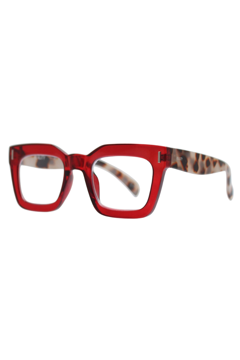 REALITY EYEWEAR
A bold blend of colour and pattern, with a striking tortoiseshell arm on the Ruby and Wood that add a playful, unexpected twist.&nbsp;The chunky rectangular frame delivers vintage-inspired confidence, while the rich colour mix makes them as much a fashion statement as they are functional. Also available in classic brown and vibrant blue, Keats proves that reading glasses can be anything but ordinary.