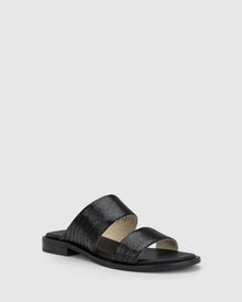 CHAOS &amp; HARMONY | WAVE SLIDE

The WAVE SLIDE in Black Snake features a subtle embossed texture that adds interest to its minimalist form. Designed as a go-to flat leather slide, it’s ideal for everyday wear — clean, easy, and comfortable from the ground up.

Black snake embossed leather slide
Soft leather lined
Black stack heel / black rubber outsole
20mm / 0.78 inch heel
Standard fit
We recommend a good leather/suede protectant to protect your shoes
Made in Dongguan, China