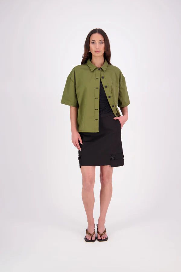 The N-E-S Demi Skirt is a fresh take on utilitarian style, reimagined as a flattering mini. Designed with a curved waistband for a versatile fit across body shapes, it features side seam pockets, a concealed centre back zip, and bold hem pocket detailing with Black buttons. Falling just above the knee, it’s the perfect mix of function and style.

Our model is 174cm and wear a XS (8)

Composition: cotton, spandex&nbsp;

Designed and Made in New Zealand