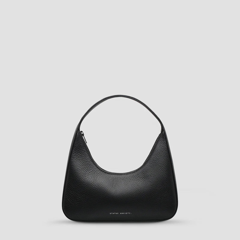Status Anxiety
A mystical and romantic encounter. 'Aurora' with her dressier, more structured form fits perfectly under your shoulder, making her the perfect wingwoman for chance meetings of the night.
