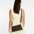 We don't take calling this bag Zenith lightly. As the new high point of your bag collection, 'Zenith' comes with a longer strap for use as a relaxed crossbody, or swap in the shorter strap to transform her into a dressier shoulder bag. On the back of the bag there's a slider pocket for easy phone storage/access, and on the front, a fancy magnet close flap that'll have you opening and closing her just for the hell of it.